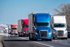 Long Convoy of Trucks on Interstate Highway